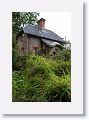 A brick cottage stands at the entrance to the Adrilaun Hotel in the outskirts of Galway