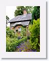 A brick cottage stands at the entrance to the Adrilaun Hotel in the outskirts of Galway